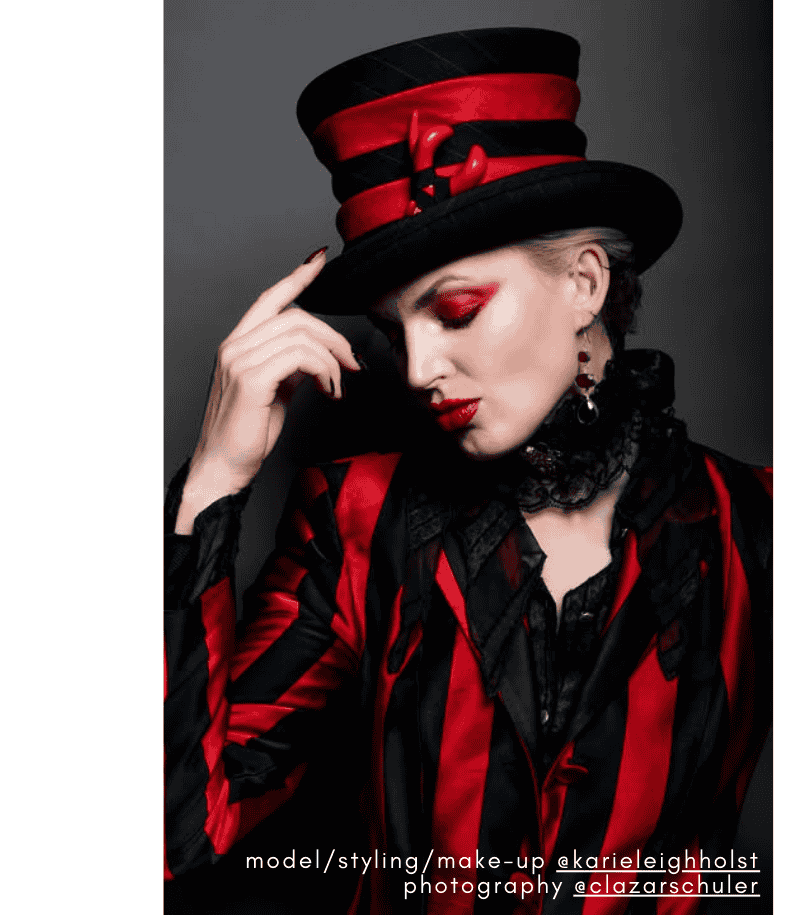 Beautiful woman wearing a black and white striped Top Hat with a clitoris.